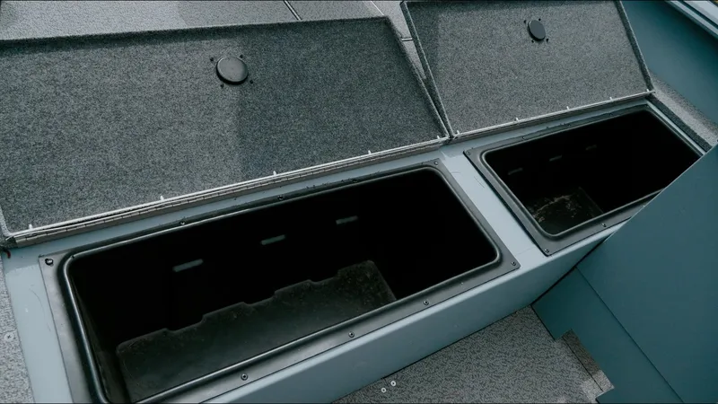 Slide: The Image of Open storage compartments on a 2025 G3 Guide V187 T boat. - 7