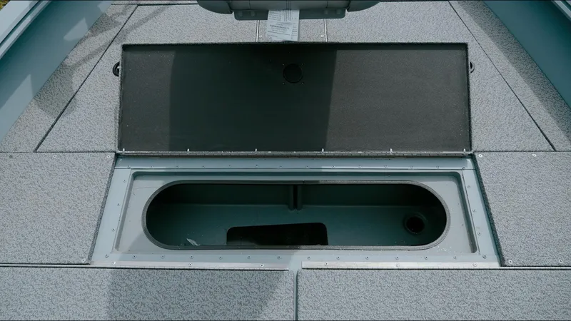 Slide: The Image of Open storage compartment on 2025 G3 Guide V187 T boat deck. - 8