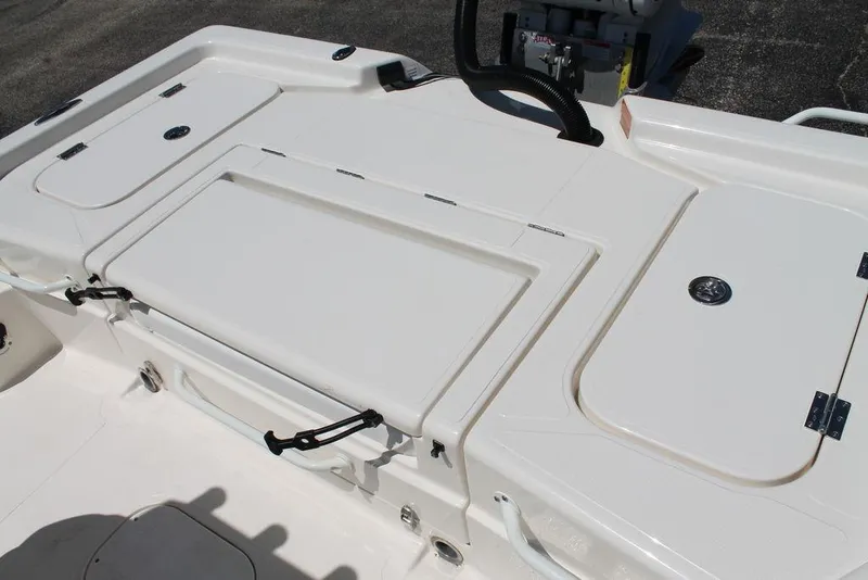 Slide: The Image of 2025 Skeeter SX241 boat deck with storage compartments and seating area. - 5