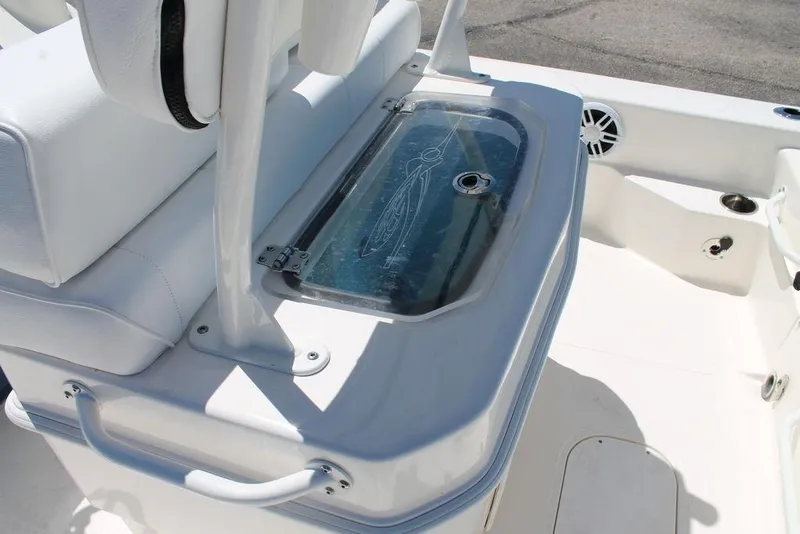 Slide: The Image of 2025 Skeeter SX241 boat interior with seating and storage compartment. - 7
