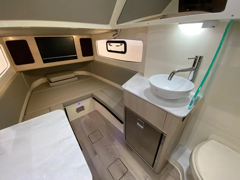 Slide: The Image of Luxurious interior of 2026 Scout 357 LXF boat with modern amenities and sleek design. - 10