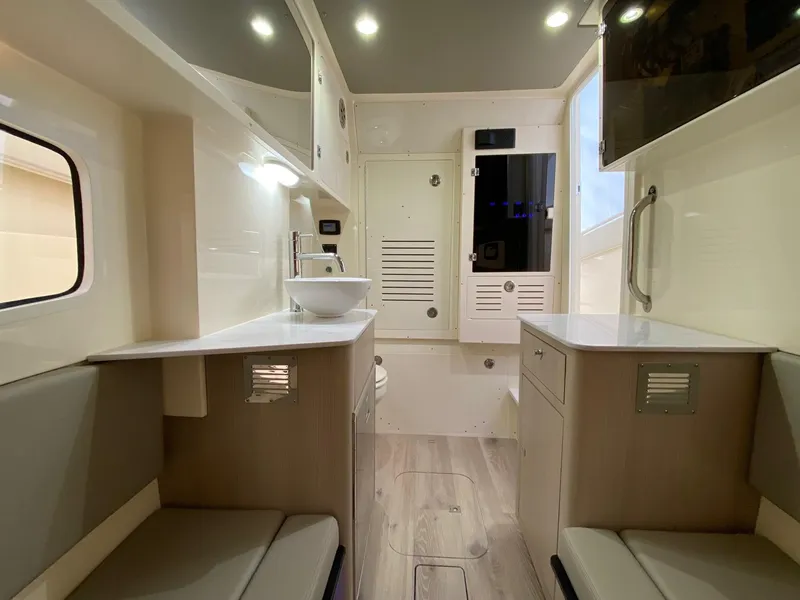 Slide: The Image of Luxurious interior of 2026 Scout 357 LXF boat featuring modern amenities and sleek design. - 11