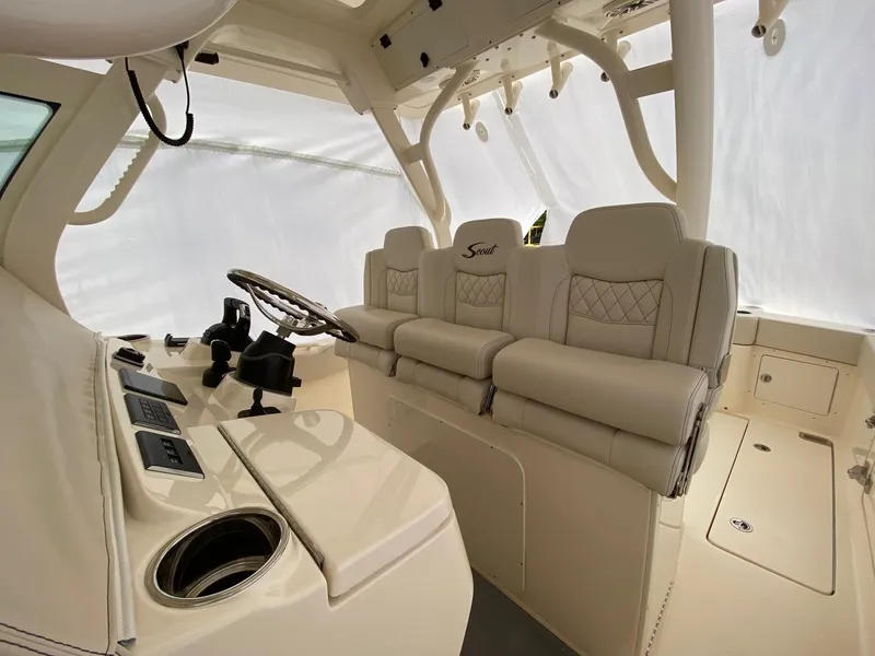 Slide: The Image of 2026 Scout 357 LXF boat interior with luxurious seating and modern helm controls. - 4