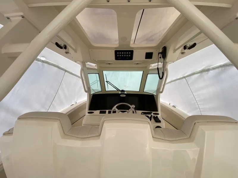 Slide: The Image of Interior view of 2026 Scout 357 LXF boat cockpit with modern controls and seating. - 5