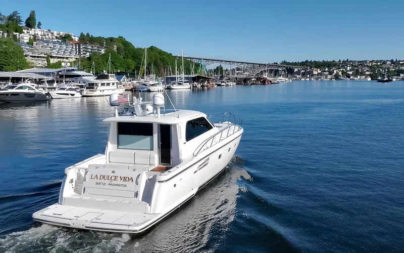 Slide: The Image of 2005 Tiara Yachts 5200 Sovran Salon cruising on a scenic waterway. - 11