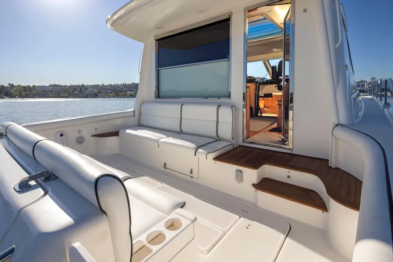 Slide: The Image of 2005 Tiara Yachts 5200 Sovran Salon, spacious deck with seating, open water view. - 12