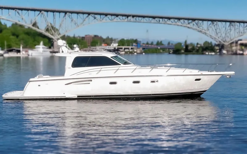 Slide: The Image of 2005 Tiara Yachts 5200 Sovran Salon cruising on a scenic waterway. - 13
