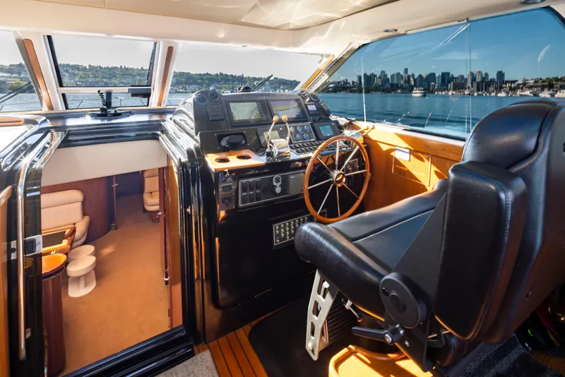 Slide: The Image of 2005 Tiara Yachts 5200 Sovran Salon helm with city skyline view. - 19