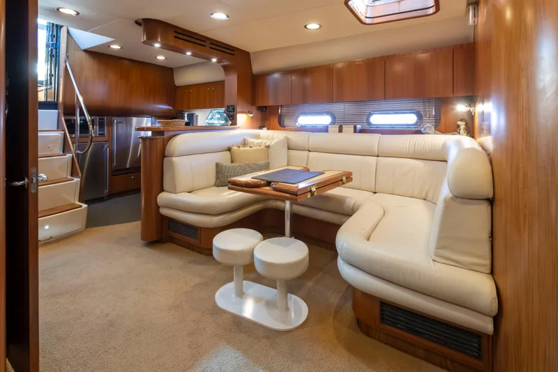 Slide: The Image of Luxurious 2005 Tiara Yachts 5200 Sovran Salon interior with plush seating and elegant wood finishes. - 26