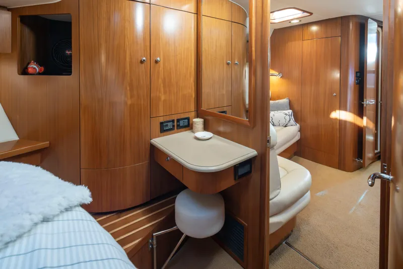 Slide: The Image of Luxurious 2005 Tiara Yachts 5200 Sovran Salon interior with wood cabinetry and cozy seating. - 27