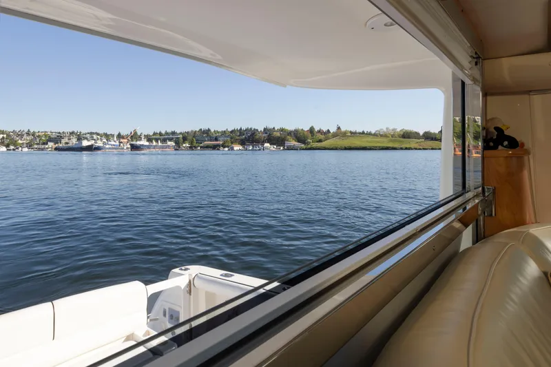 Slide: The Image of View from 2005 Tiara Yachts 5200 Sovran Salon, overlooking serene waters and distant shoreline. - 28