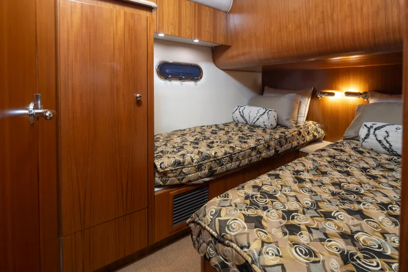 Slide: The Image of Luxurious cabin interior of 2005 Tiara Yachts 5200 Sovran Salon with twin beds. - 33
