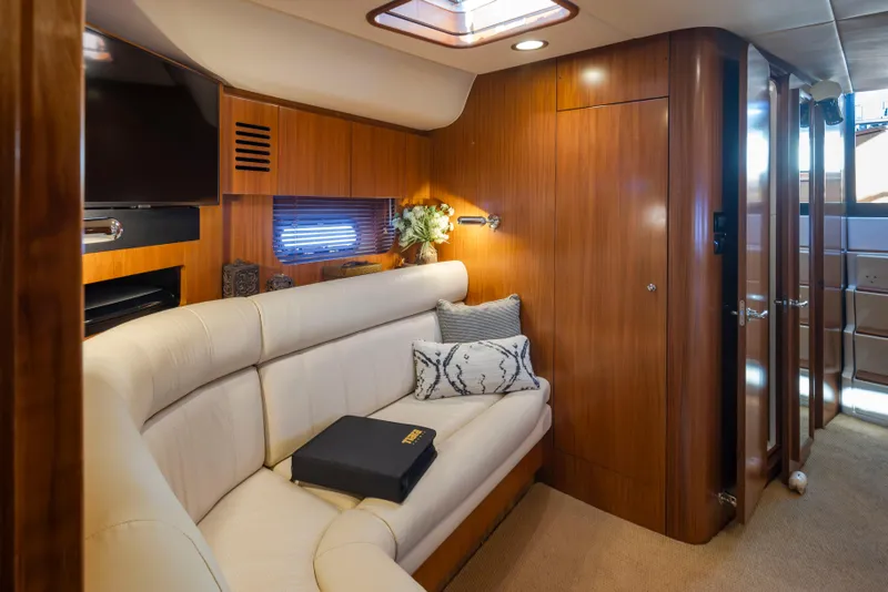 Slide: The Image of Luxurious 2005 Tiara Yachts 5200 Sovran Salon interior with elegant wood paneling and plush seating. - 34