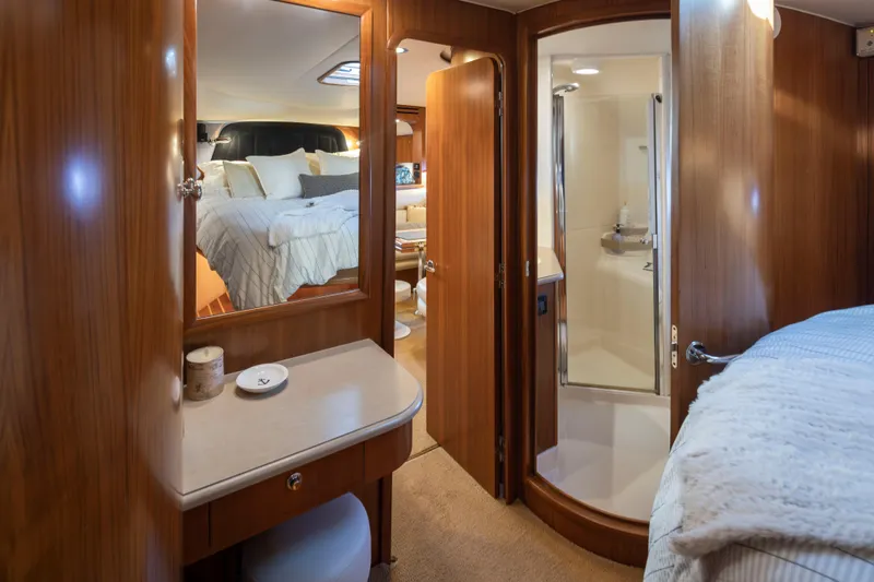 Slide: The Image of Luxurious 2005 Tiara Yachts 5200 Sovran Salon interior with cozy bedroom and elegant bathroom. - 35