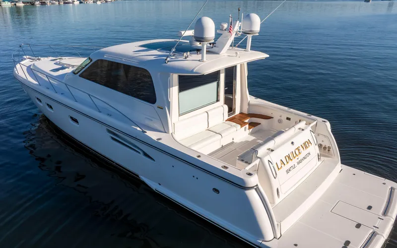 Slide: The Image of 2005 Tiara Yachts 5200 Sovran Salon cruising on calm waters. - 7