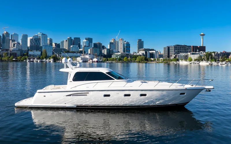 Slide: The Image of 2005 Tiara Yachts 5200 Sovran Salon on water with city skyline background. - 8