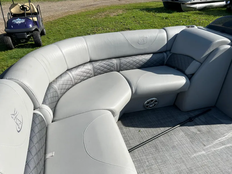 Slide: The Image of 2019 Misty Harbor Biscayne Bay 2285BR boat interior with gray cushioned seating. - 10