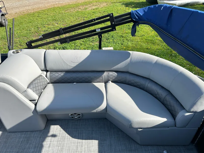 Slide: The Image of 2019 Misty Harbor Biscayne Bay 2285BR Triple Tube boat with gray seating and blue cover. - 13