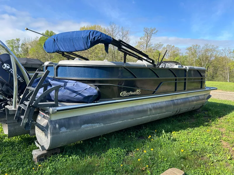 Slide: The Image of 2019 Misty Harbor Biscayne Bay 2285BR Triple Tube pontoon boat on grassy field. - 5