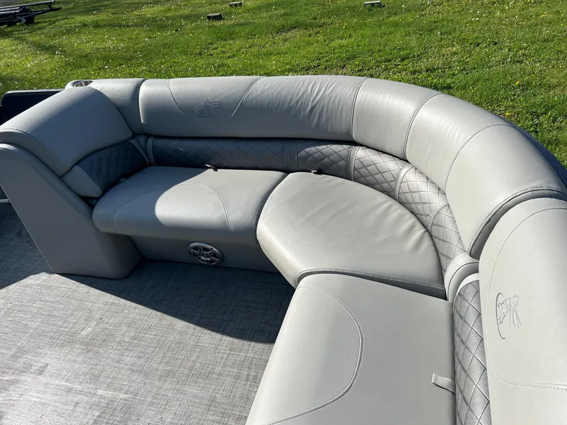 Slide: The Image of 2019 Misty Harbor Biscayne Bay 2285BR boat seating, featuring gray upholstery and spacious design. - 9