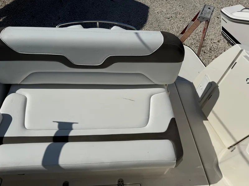 Slide: The Image of 2013 Monterey 320 Sport Yacht seating area with white and black upholstery. - 15