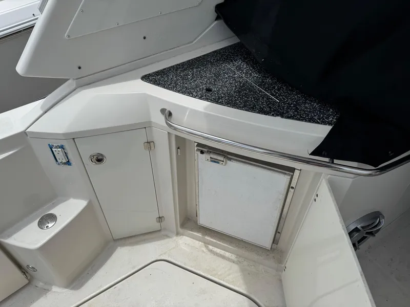 Slide: The Image of 2013 Monterey 320 Sport Yacht interior with storage and counter space. - 18