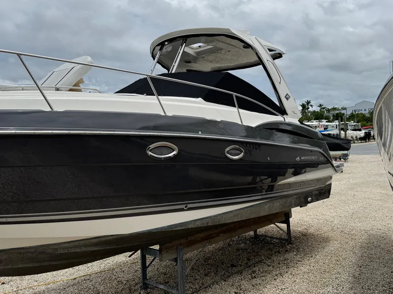 Slide: The Image of 2013 Monterey 320 Sport Yacht on display, featuring sleek design and modern amenities. - 2