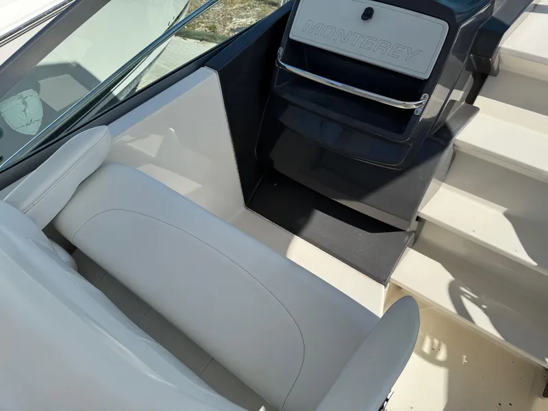 Slide: The Image of 2013 Monterey 320 Sport Yacht interior with white seating and steps. - 20