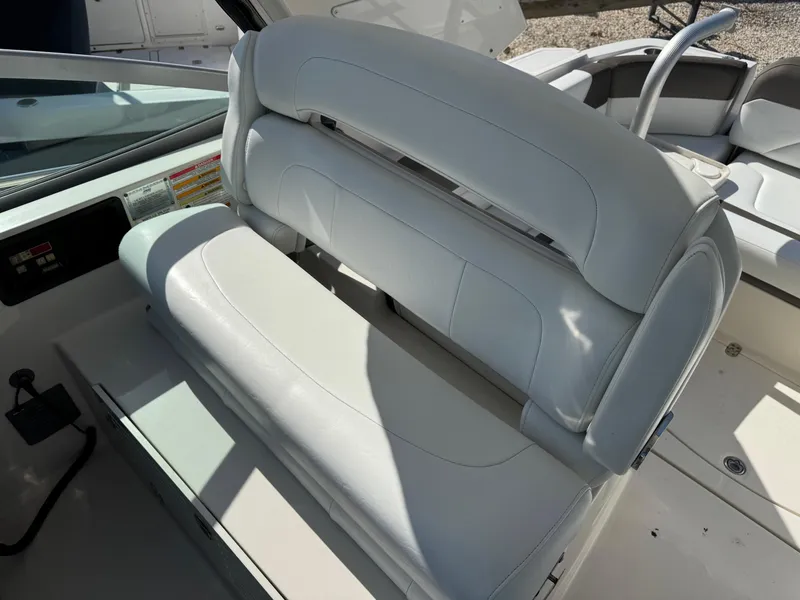 Slide: The Image of 2013 Monterey 320 Sport Yacht interior seating, white leather upholstery, modern design. - 24