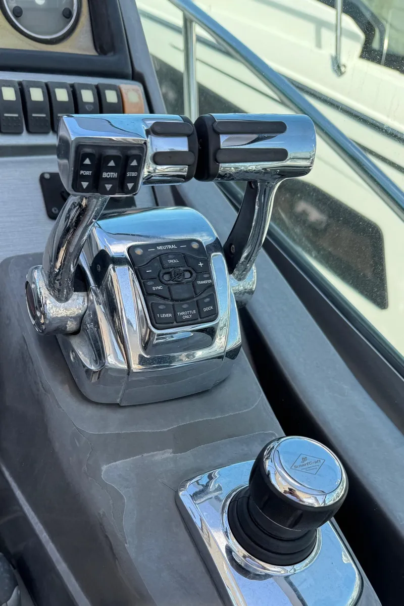 Slide: The Image of Close-up of 2013 Monterey 320 Sport Yacht controls and throttle levers. - 29
