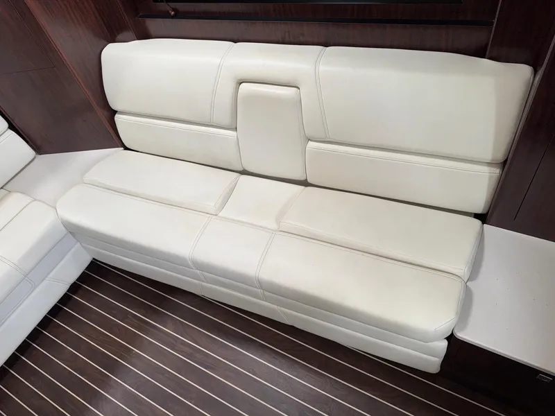 Slide: The Image of Luxurious white leather seating on 2013 Monterey 320 Sport Yacht with wooden flooring. - 44