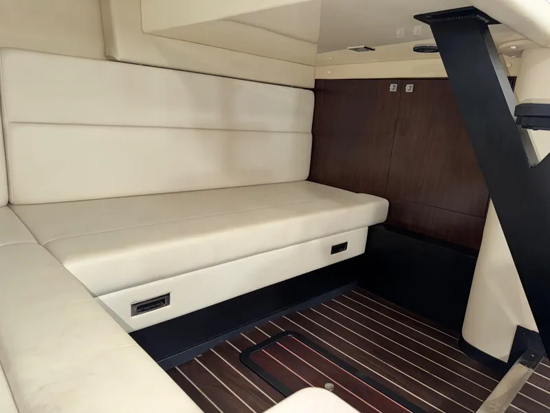 Slide: The Image of Interior of 2013 Monterey 320 Sport Yacht with beige seating and wooden flooring. - 46