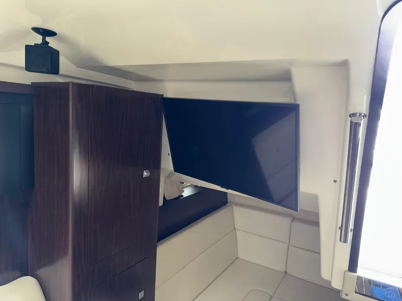 Slide: The Image of Interior of 2013 Monterey 320 Sport Yacht with TV and seating area. - 47