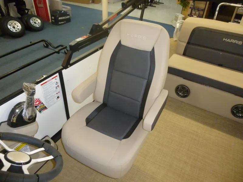 Slide: The Image of 2024 Harris CX210 boat interior with beige and gray captain's chair. - 3