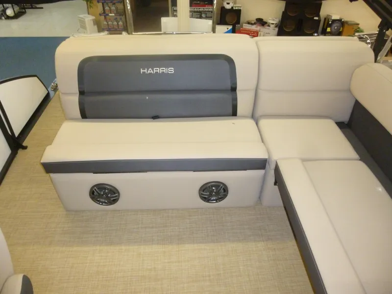Slide: The Image of 2024 Harris CX210 boat seating with integrated speakers, beige and gray upholstery. - 4