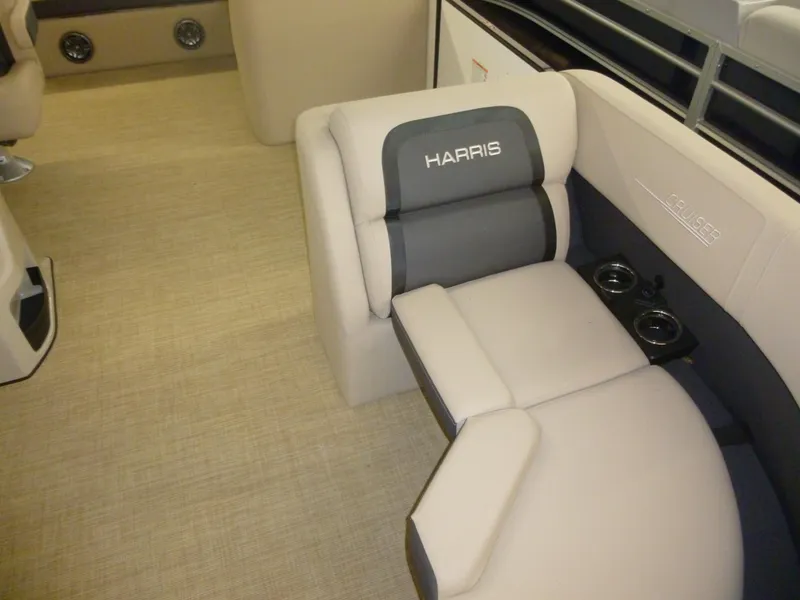 Slide: The Image of 2024 Harris CX210 boat interior with beige seating and cup holders. - 7