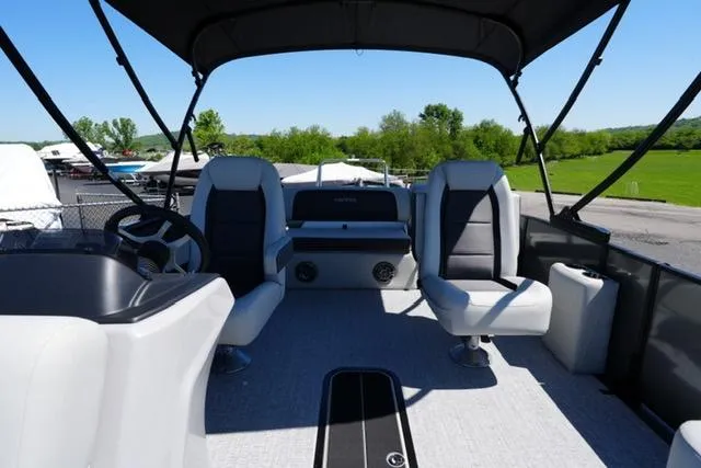 Slide: The Image of 2025 Harris Cruiser 210 pontoon boat interior with seating and steering wheel. - 10