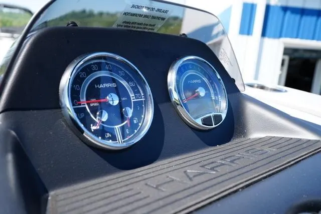 Slide: The Image of Dashboard of 2025 Harris Cruiser 210 boat with speedometer and tachometer. - 13