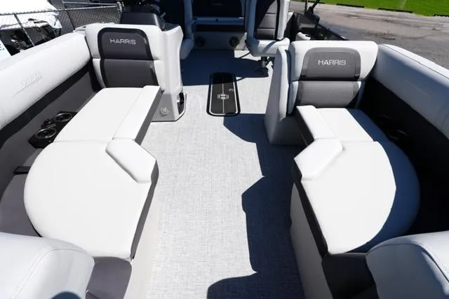 Slide: The Image of 2025 Harris Cruiser 210 interior with plush seating and modern design. - 8