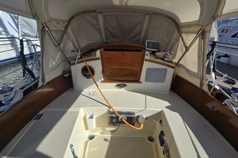 Slide: The Image of 1994 Bristol Channel Cutter Sam L Morse BCC 28 cockpit with wooden accents and nautical equipment. - 15