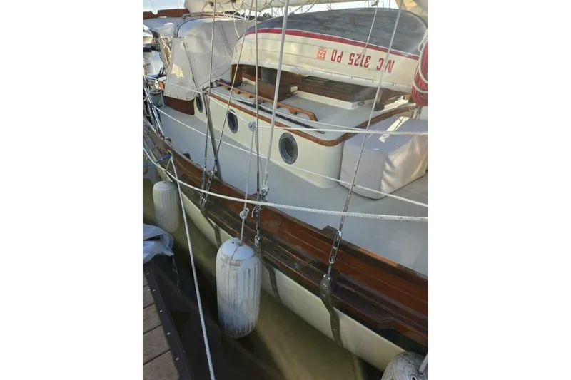 Slide: The Image of 1994 Bristol Channel Cutter Sam L Morse BCC 28 docked with fenders and rigging visible. - 10