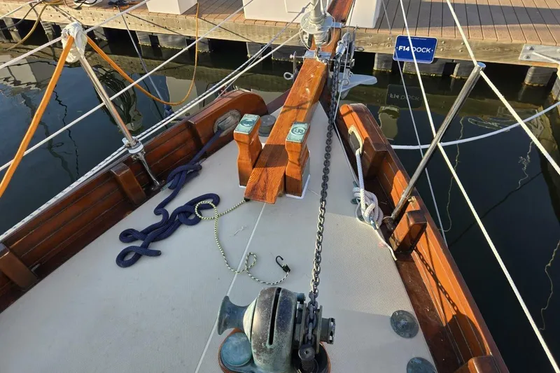 Slide: The Image of Bristol Channel Cutter 1994, Sam L Morse BCC 28, docked with nautical ropes and equipment. - 11