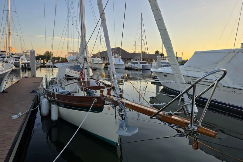 Slide: The Image of 1994 Bristol Channel Cutter Sam L Morse BCC 28 docked at sunset in a marina. - 3