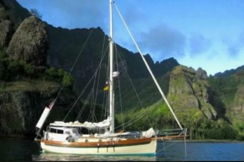 Slide: The Image of 1994 Bristol Channel Cutter Sam L Morse BCC 28 sailboat in scenic mountainous bay. - 35