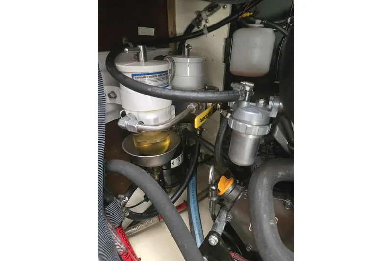 Slide: The Image of Engine compartment of 1994 Bristol Channel Cutter Sam L Morse BCC 28, showing fuel filters and hoses. - 36