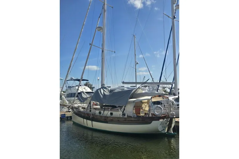 Slide: The Image of 1994 Bristol Channel Cutter Sam L Morse BCC 28 sailboat docked at marina. - 7