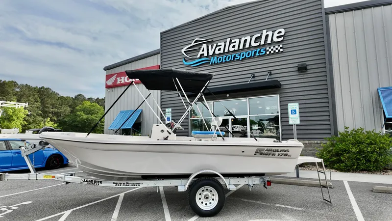 The Image of 2025 Carolina Skiff 178 JLS CC boat on trailer at Avalanche Motorsports dealership. - 1