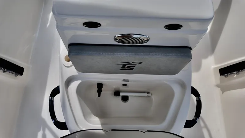 Slide: The Image of 2025 Carolina Skiff 178 JLS CC boat interior with storage compartment and seating. - 5