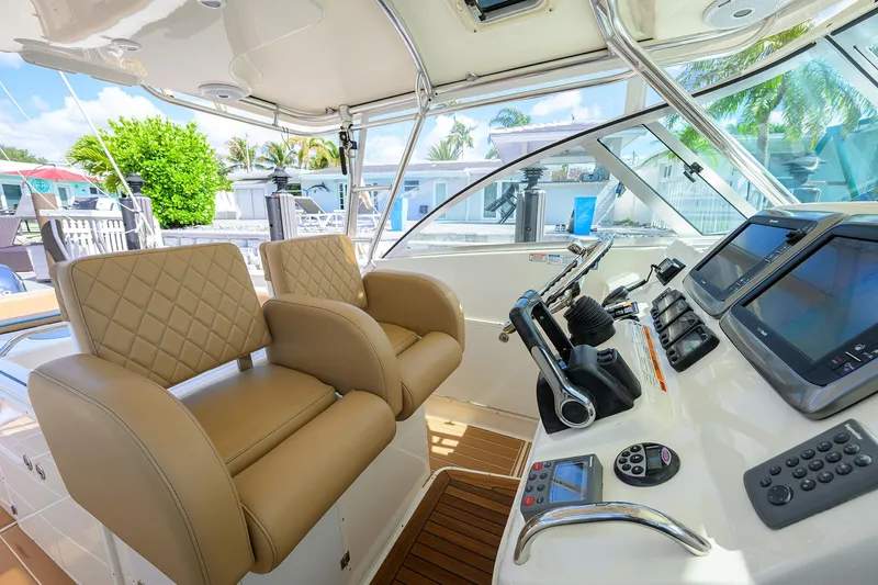 Slide: The Image of Pursuit 34 Nauti-Hooker - Helm Electronics and Seating - 12