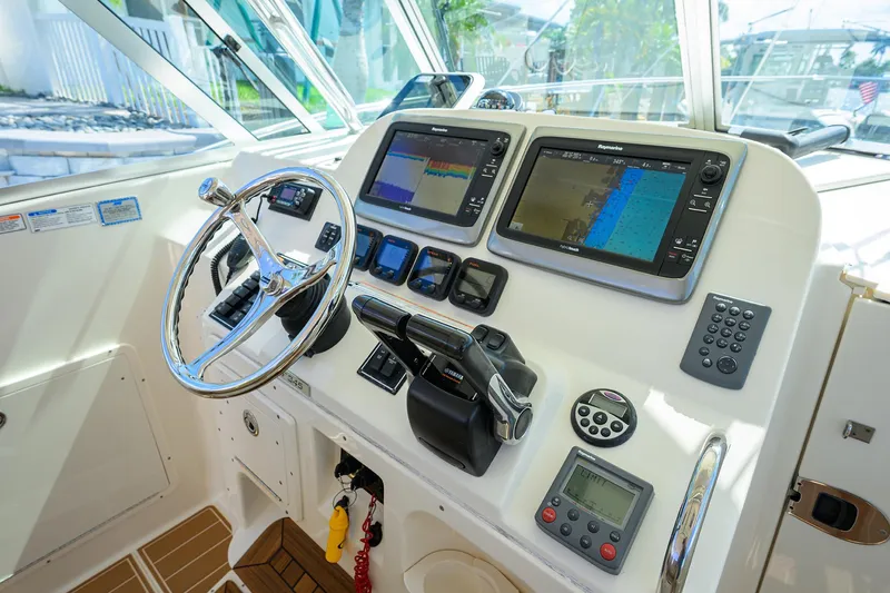 Slide: The Image of Pursuit 34 Nauti-Hooker - Helm Electronics and Seating - 14